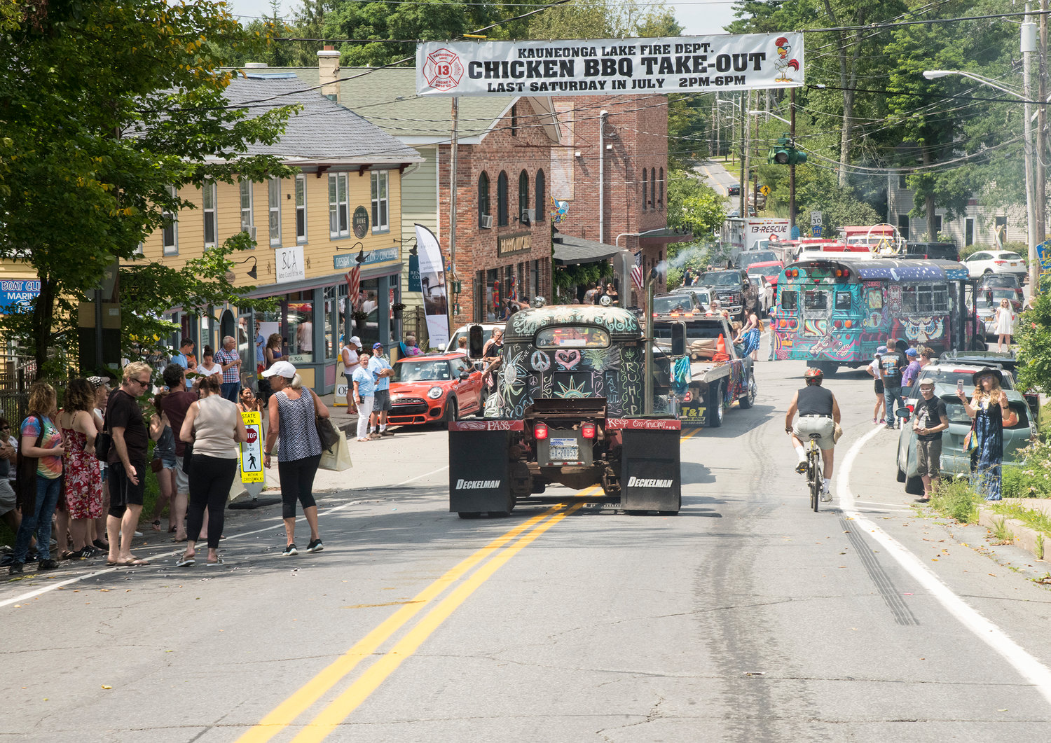 The parade ended in downtown Kauneonga Lake at the Town Square. The festivities continued all day with a chicken BBQ fundraiser hosted by the Kauneonga Lake Firehouse, followed by hours of live music into an evening of outdoor viewing of two Woodstock-related films.
